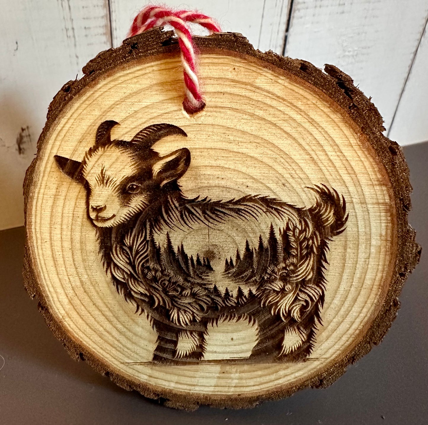 Engraved Live Edge Wooden Round Ornament - Goat with Inner Wilderness Scene