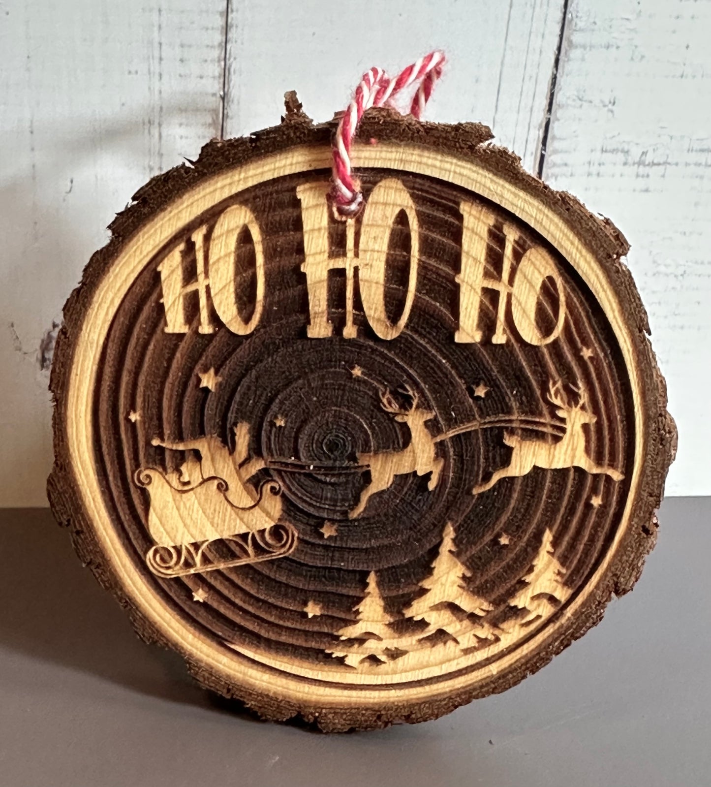Engraved Live Edge Wooden Round Ornament - Ho Ho Ho, Santa’s Sleigh and Reindeer