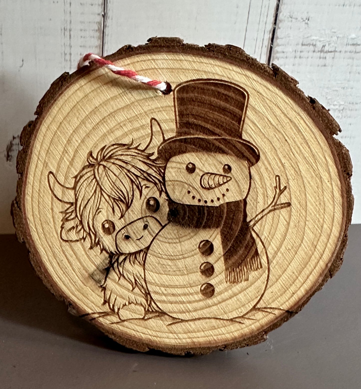 Engraved Live Edge Wooden Round Ornament - Highland Coo and Snowman
