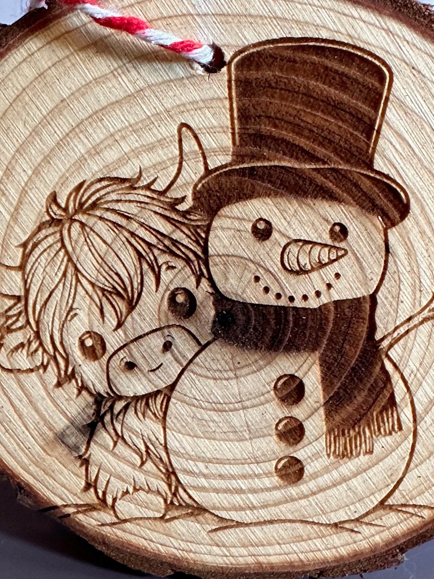 Engraved Live Edge Wooden Round Ornament - Highland Coo and Snowman
