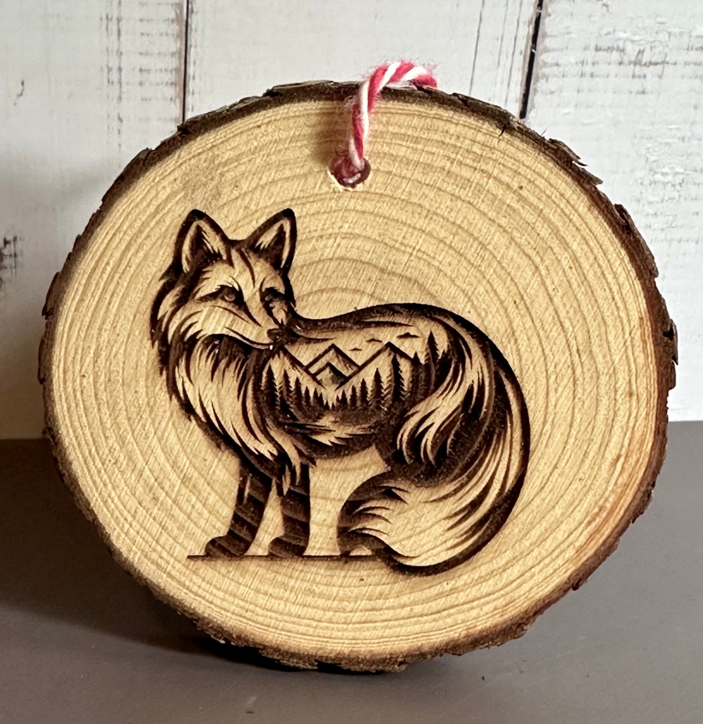 Engraved Live Edge Wooden Round Ornament - Fox with Inner Wilderness Scene