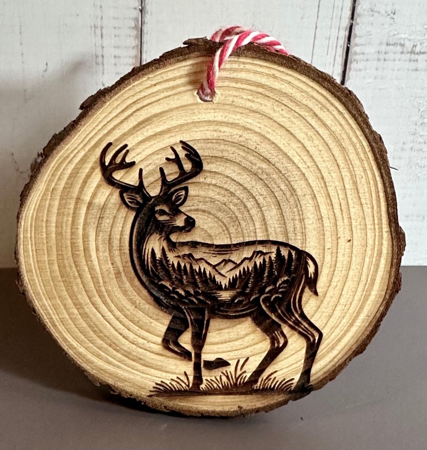 Engraved Live Edge Wooden Round Ornament - Deer with Inner Wilderness Scene