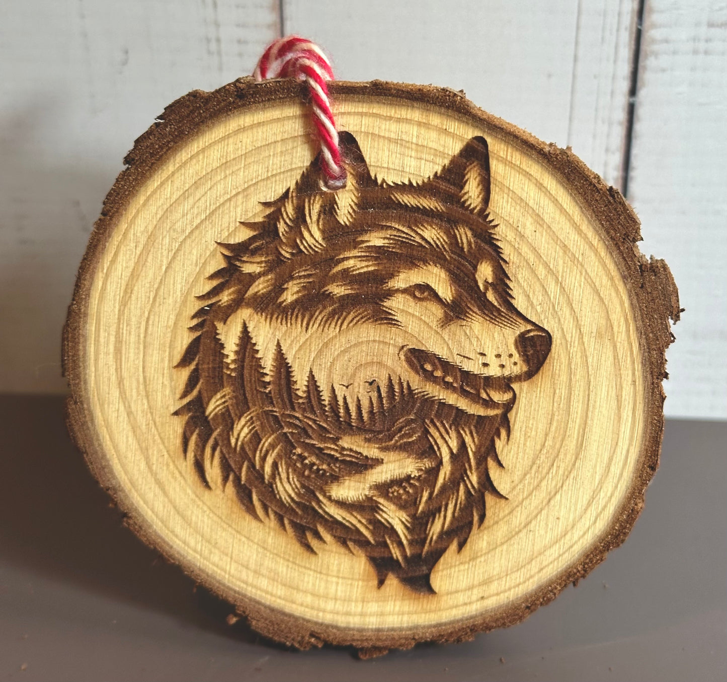 Engraved Live Edge Wooden Round Ornament - Wolf with Inner Wilderness Scene