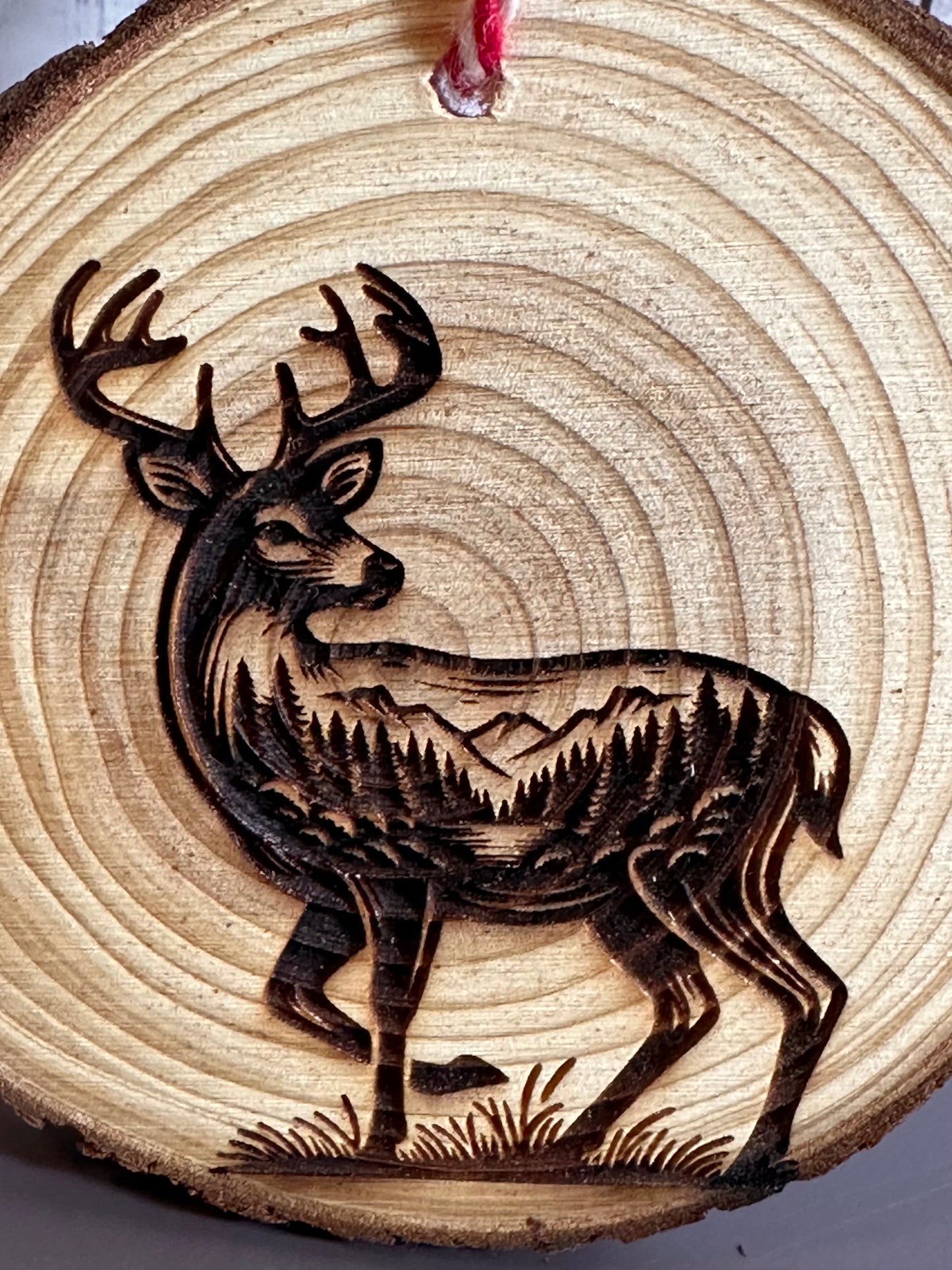 Engraved Live Edge Wooden Round Ornament - Deer with Inner Wilderness Scene