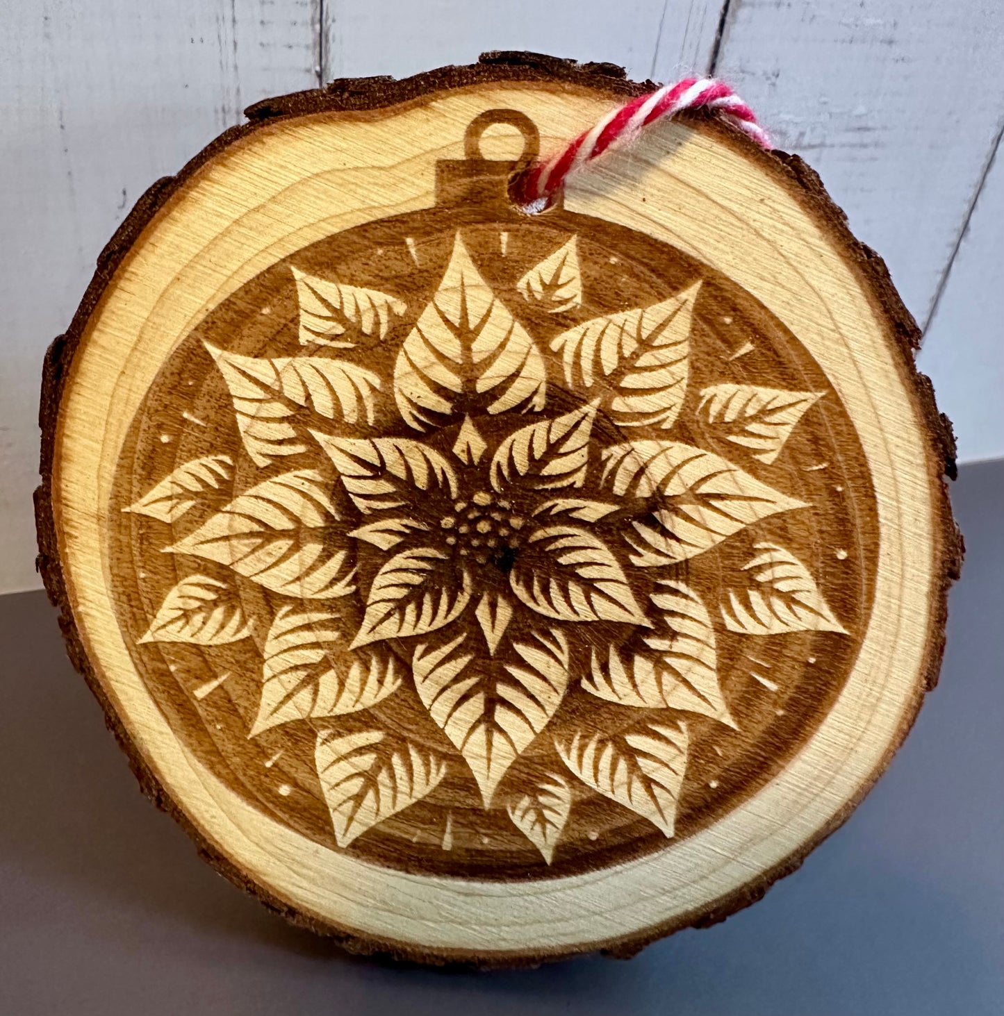 Engraved Live Edge Wooden Round Ornament - Poinsettia Flower