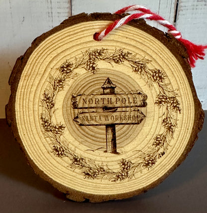 Engraved Live Edge Wooden Round Ornament - North Pole & Santa’s Workshop Sign