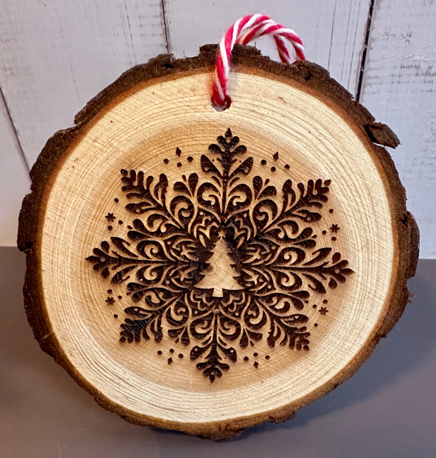 Engraved Live Edge Wooden Round Ornament - Ornate Snowflake with Tree in Middle