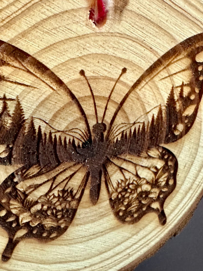 Engraved Live Edge Wooden Round Ornament - Butterfly with Inner Wilderness Scene