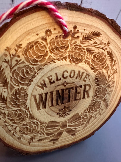 Engraved Live Edge Wooden Round Ornament - Welcome Winter with Pinecone Wreath