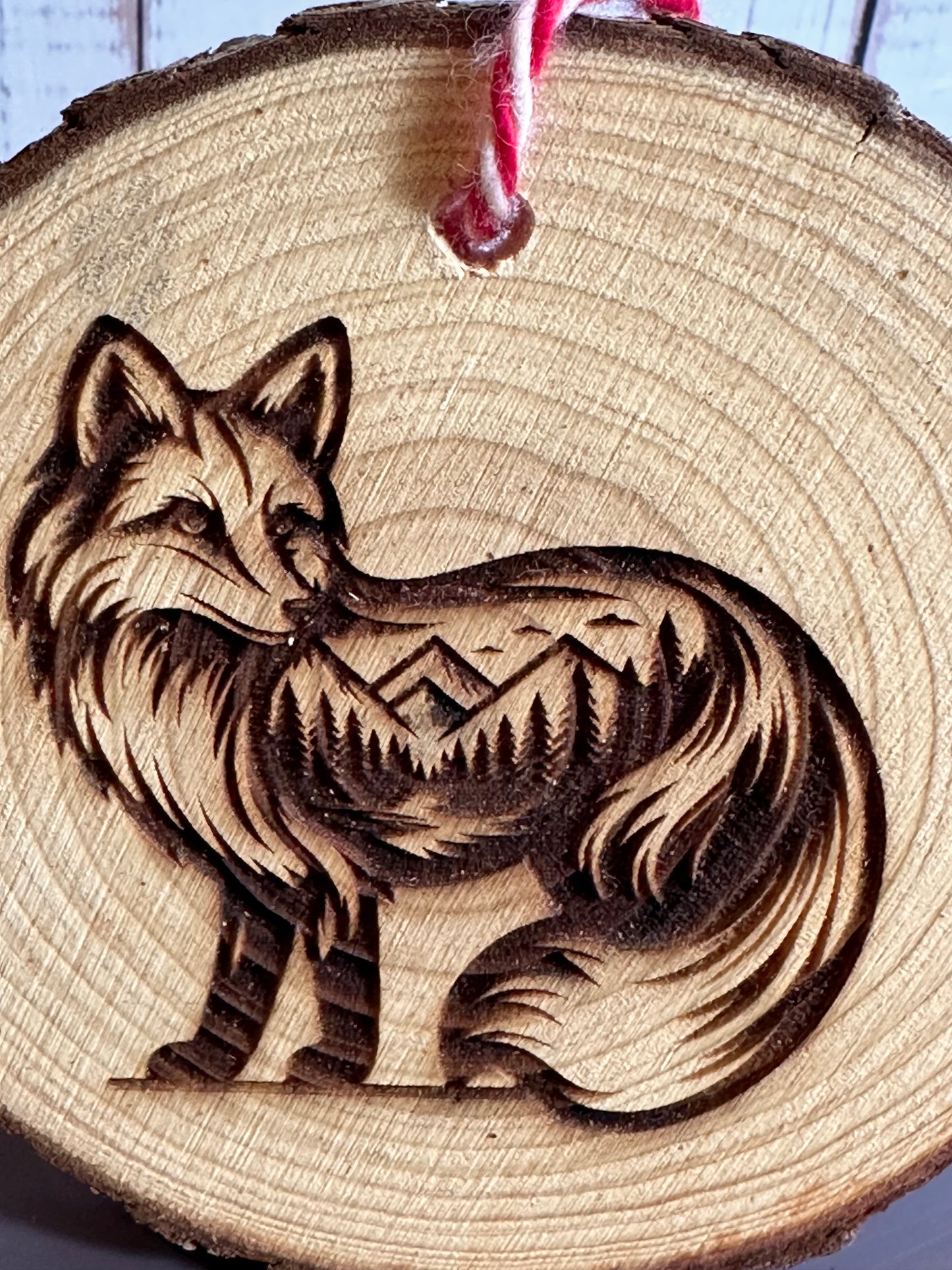 Engraved Live Edge Wooden Round Ornament - Fox with Inner Wilderness Scene