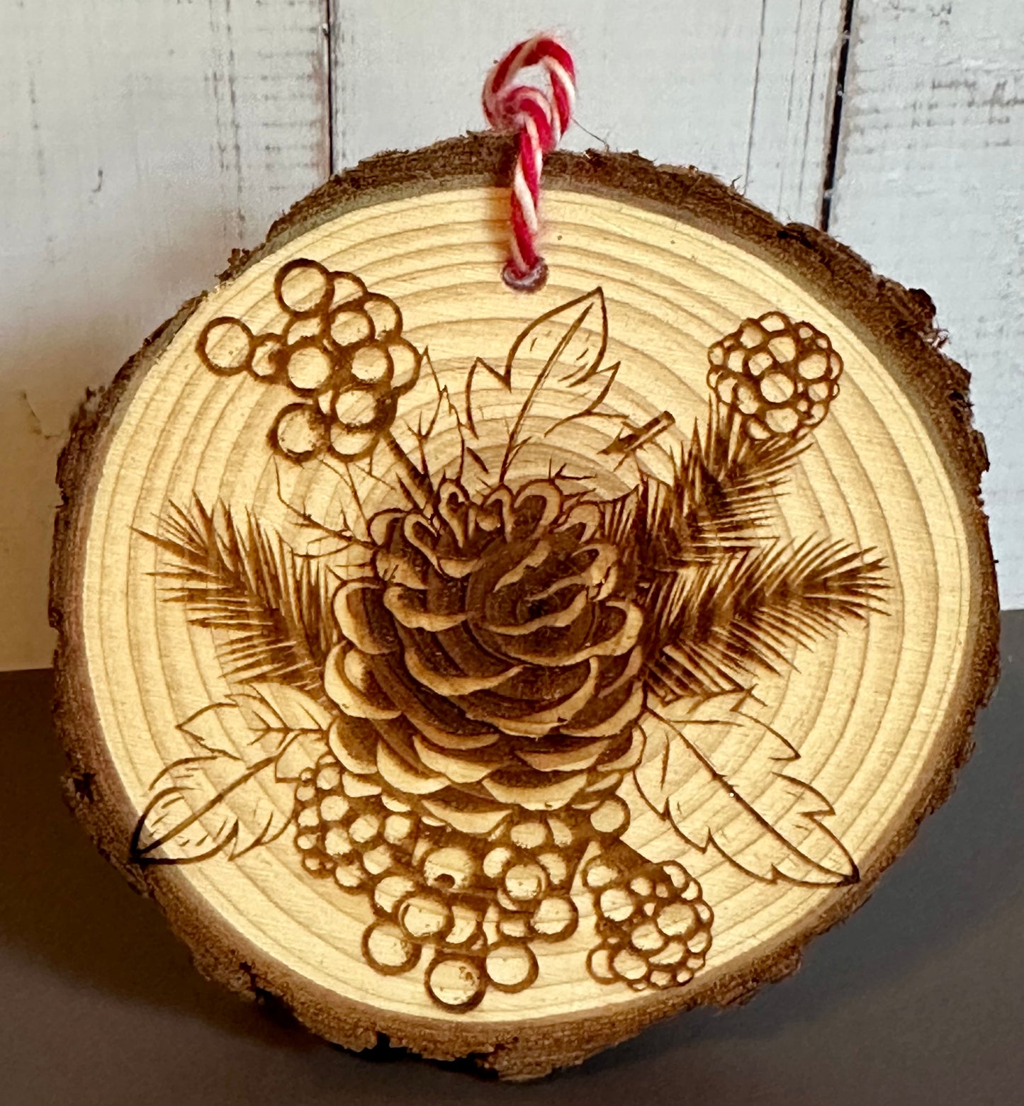 Engraved Live Edge Wooden Round Ornament - Pinecone with Berries